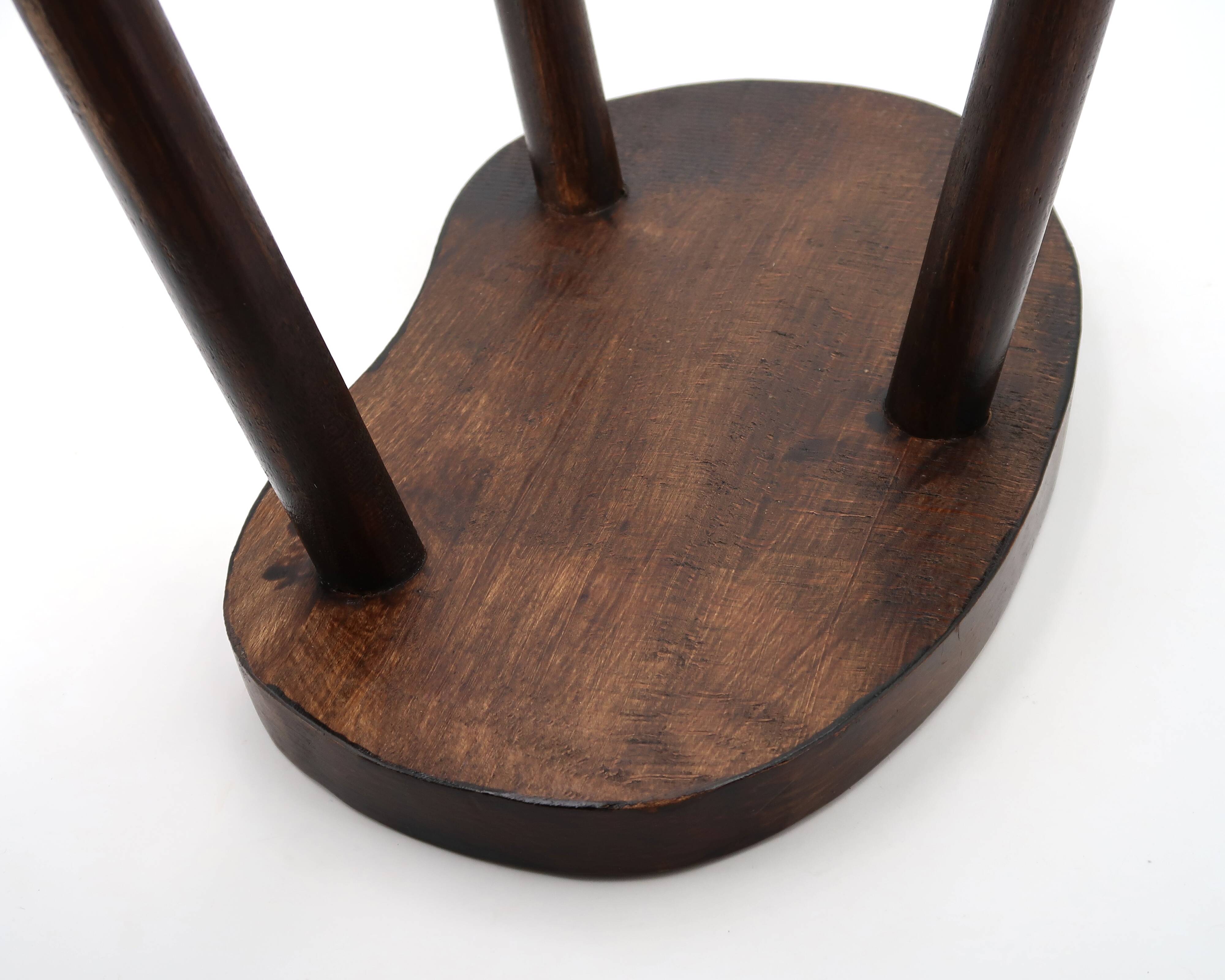 Wooden tripod bedside or occasional table, bean-shaped top.