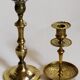 Duo of solid brass and gold metal candle holders worked old
