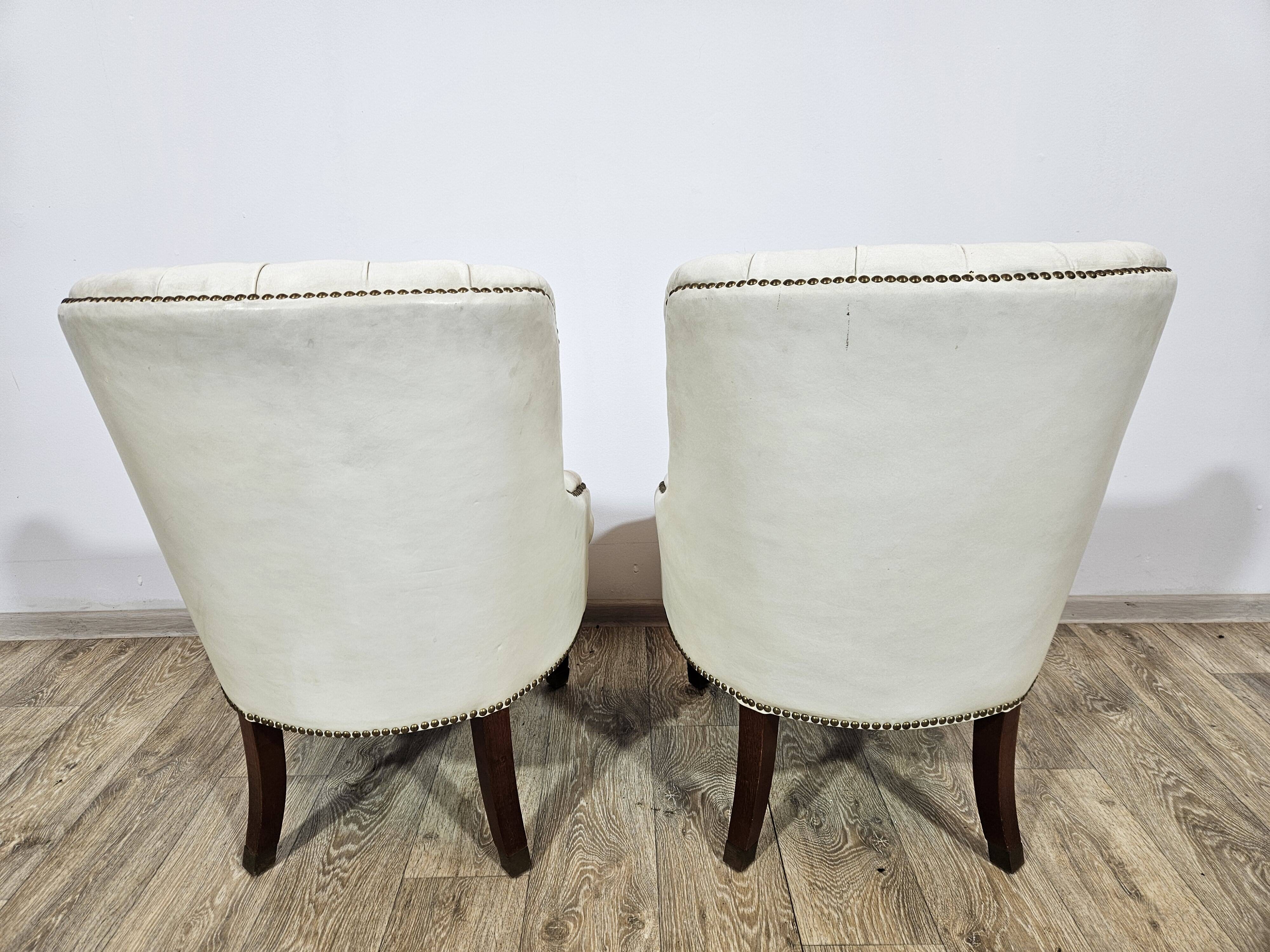 A pair of chesterfield armchairs, England, 1960s