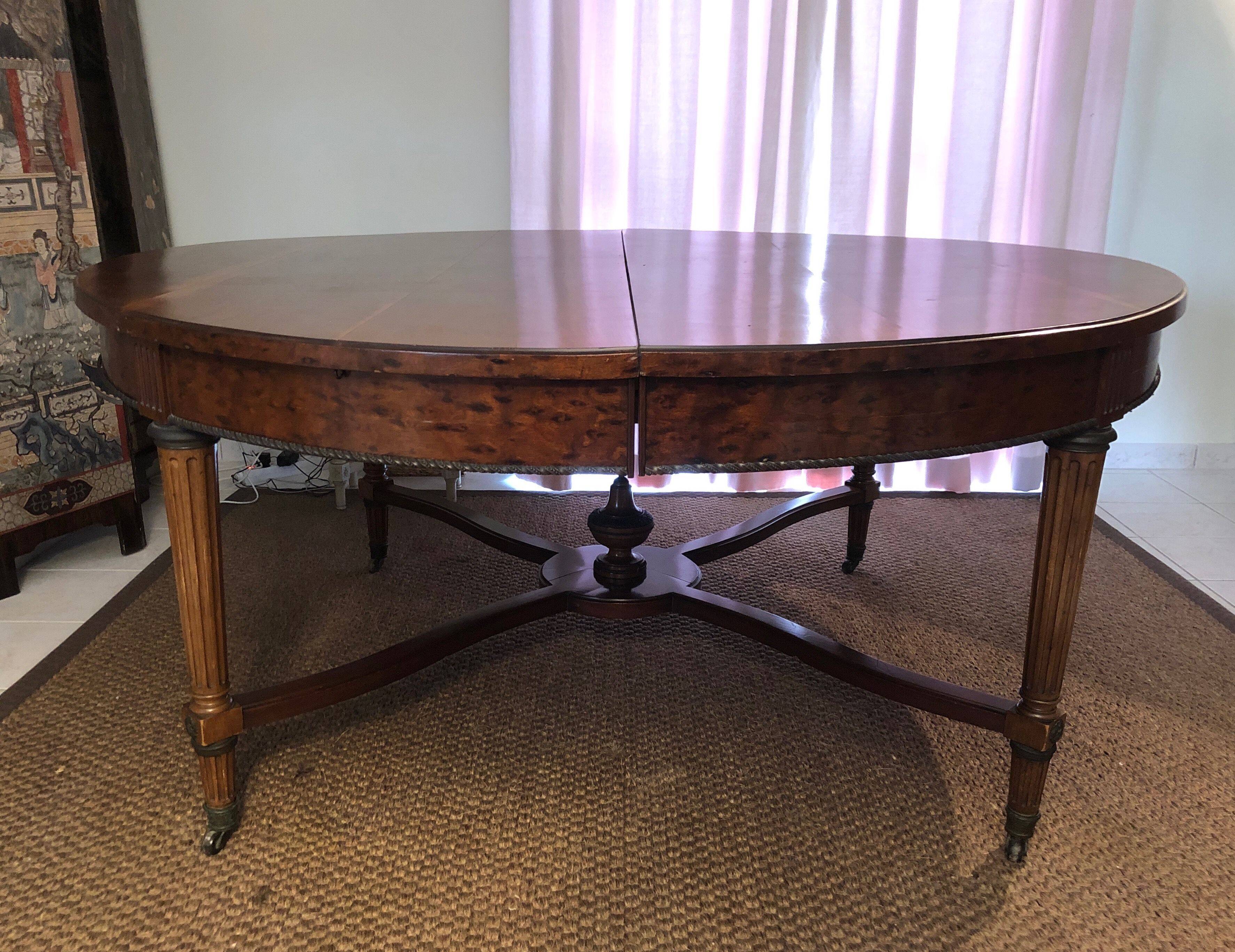 Important central pedestal table in mahogany, brass and bronze that can form a large dining table.