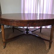 Important central pedestal table in mahogany, brass and bronze that can form a large dining table.