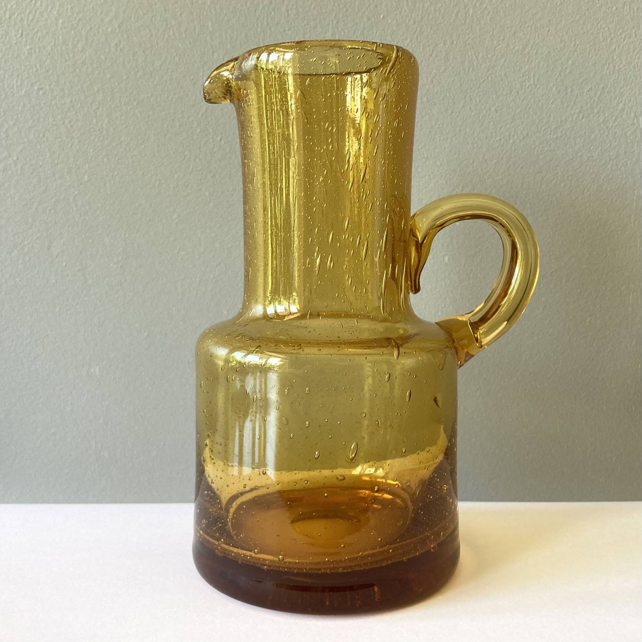 Vintage pitcher or jug forming a vase in amber and bubbled glass in the style of Biot glassware