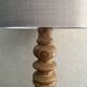 Wooden turned totem lamp with a linen shade in a vintage Scandinavian style.