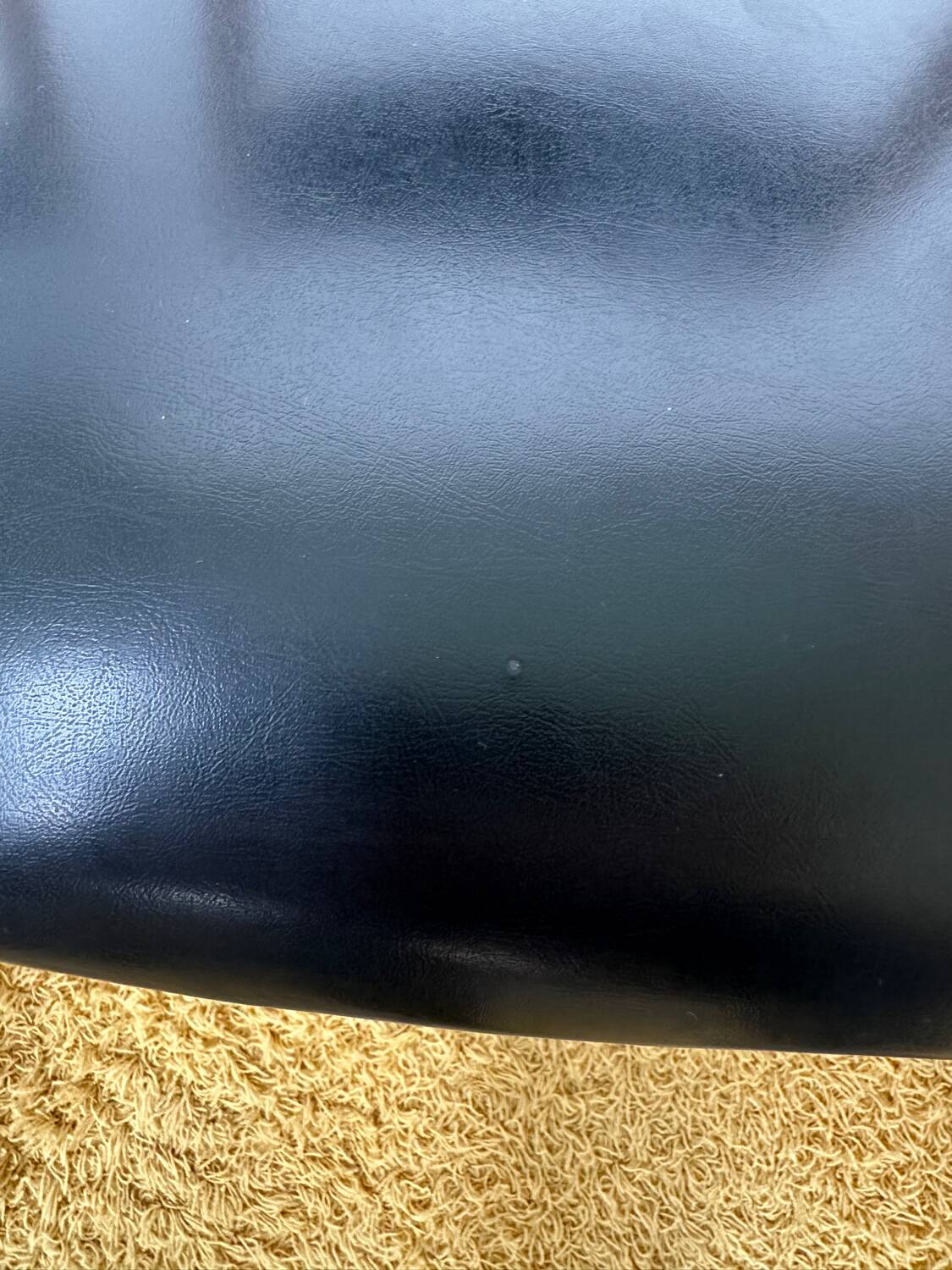 4 Scandinavian chairs in teak and black faux leather.