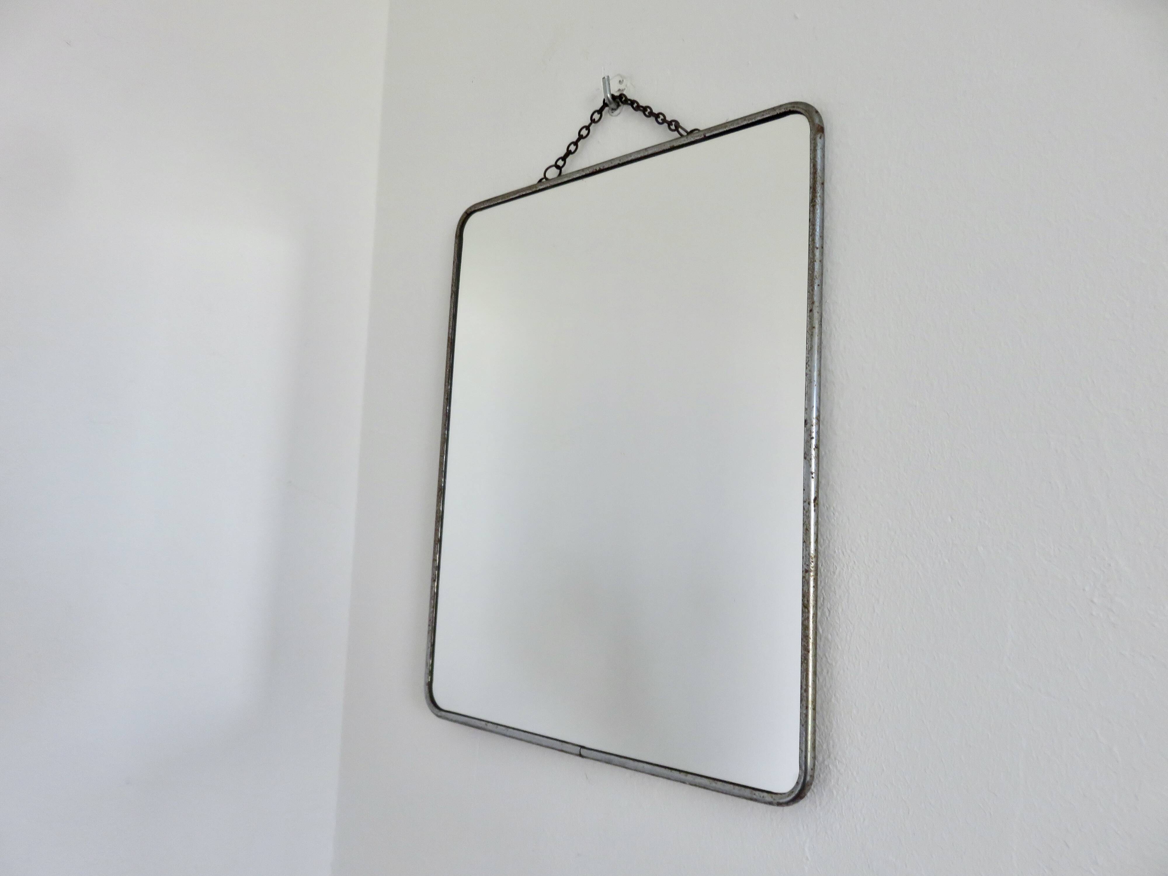 Old barber's mirror with chain, 1950s and 1960s