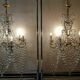 A pair of imposing, antique chandeliers with pendants.