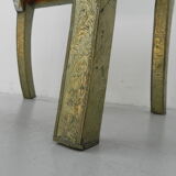 Dining chair upholstered with stamped tin