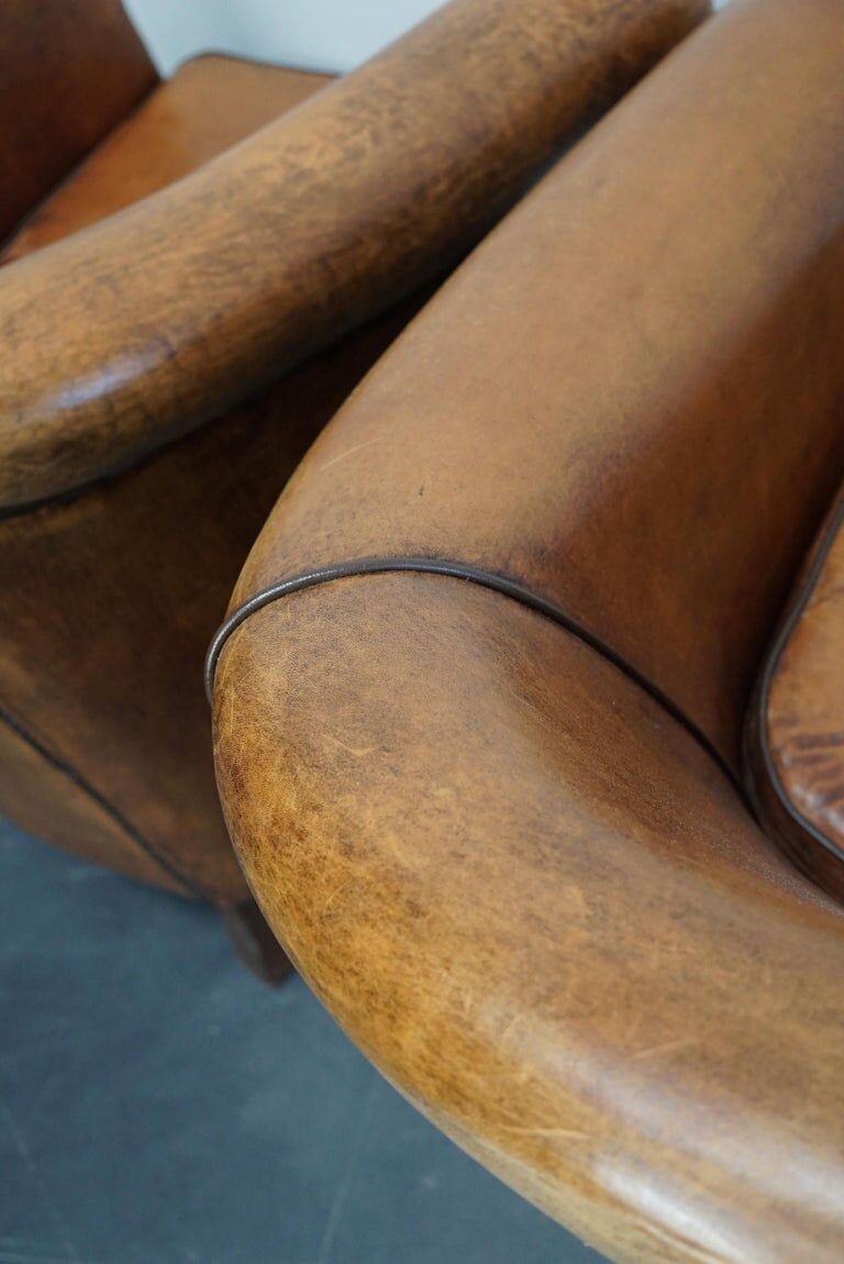 Set of 2 club armchairs with vintage leather footrest Netherlands