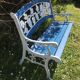 Wood garden bench and iron cast iron. Grape clusters