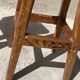 Pair of vintage wooden workshop stools with a patina.