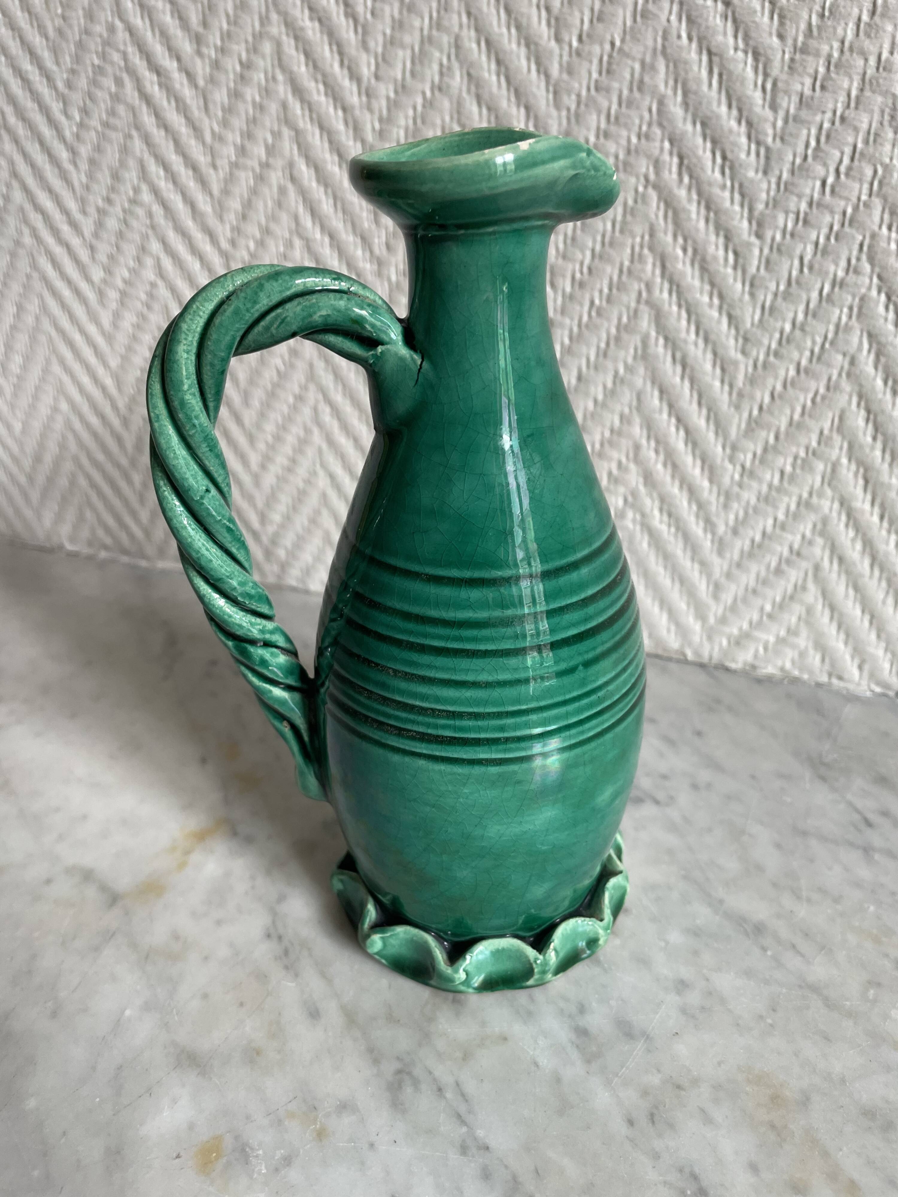 Small green ceramic pitcher