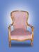 Fauteuil rose en bois