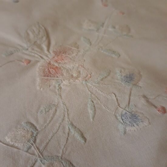 White tablecloth embroidered with lace & days