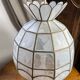Suspension in white mother-of-pearl and brass
