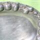 Service tray made of cast aluminium with vegetable decoration