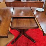 Baumann style round table with integrated extensions from the 70s