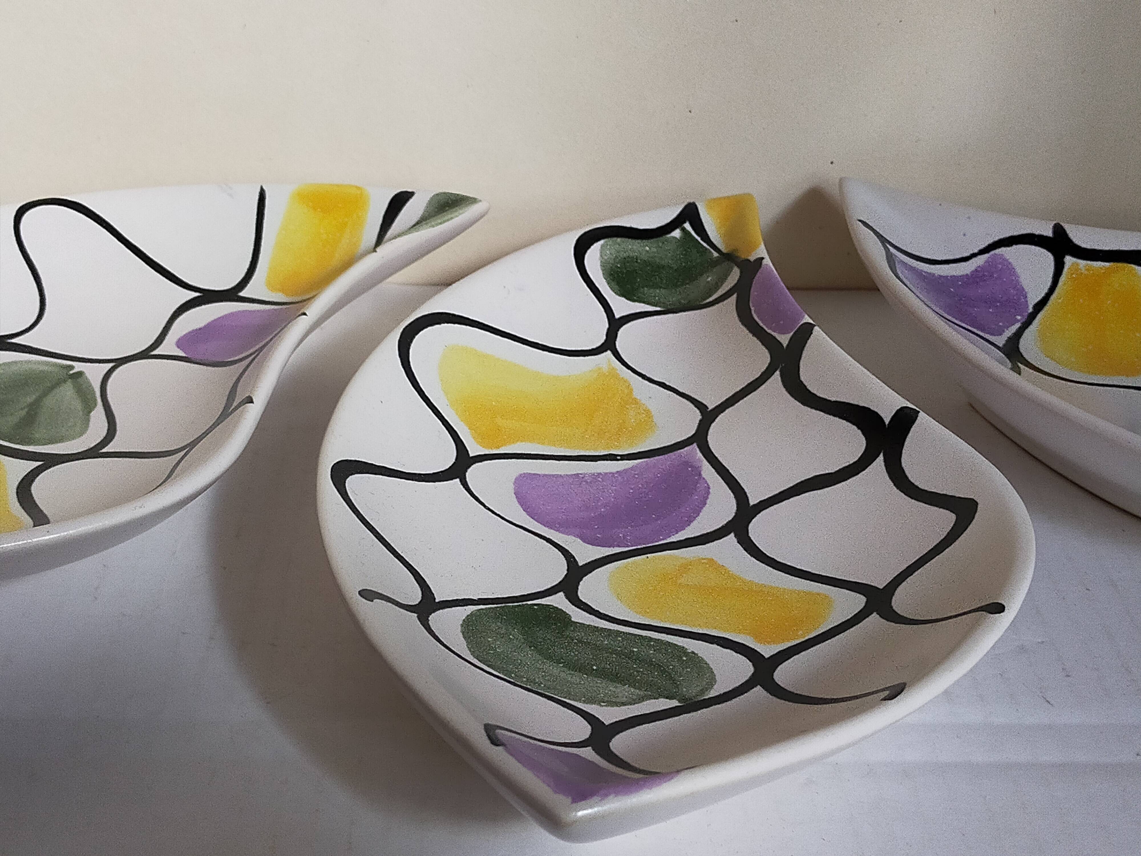 Three vintage free-form ceramic ravine dishes from the 1950s