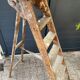 Antique authentic painter's stepladder in vintage patinated wood