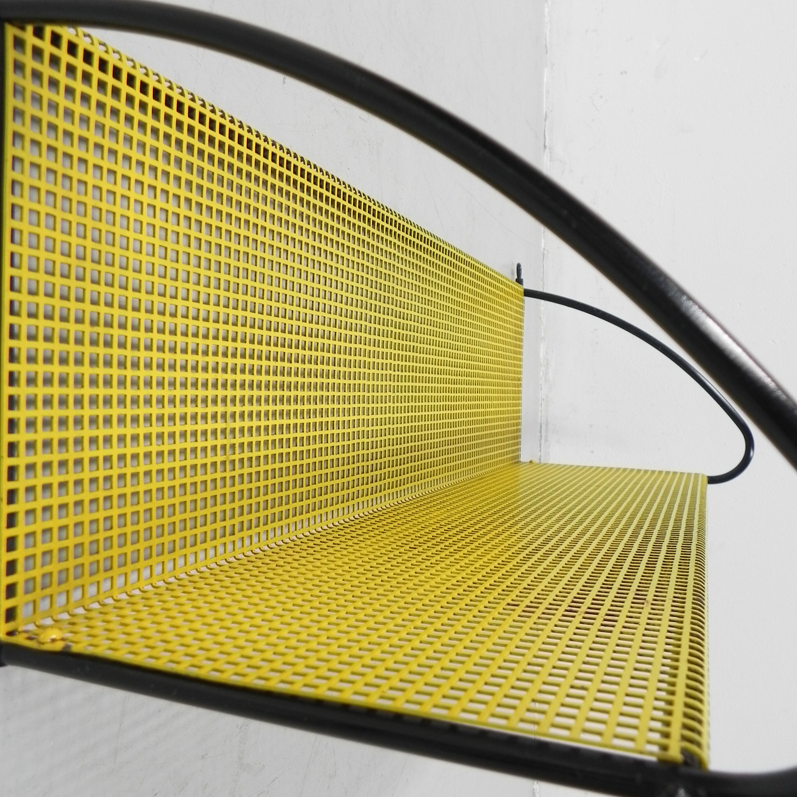 Pilastro wall rack with perforated steel plate