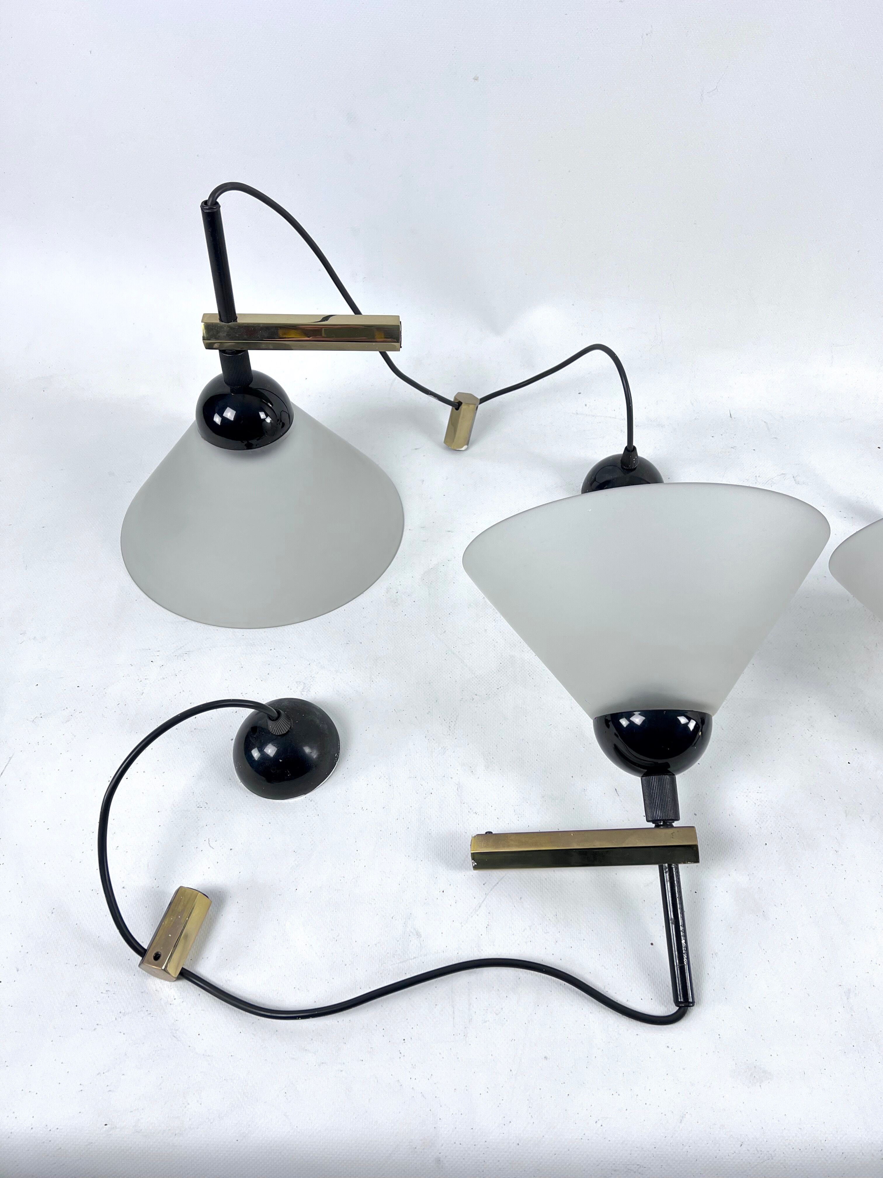 Rare Set of four Italian Modern brass and Murano glass wall lamps by Quattrifolio. 1970s
