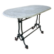 Art Nouveau cast iron and marble bistro table.