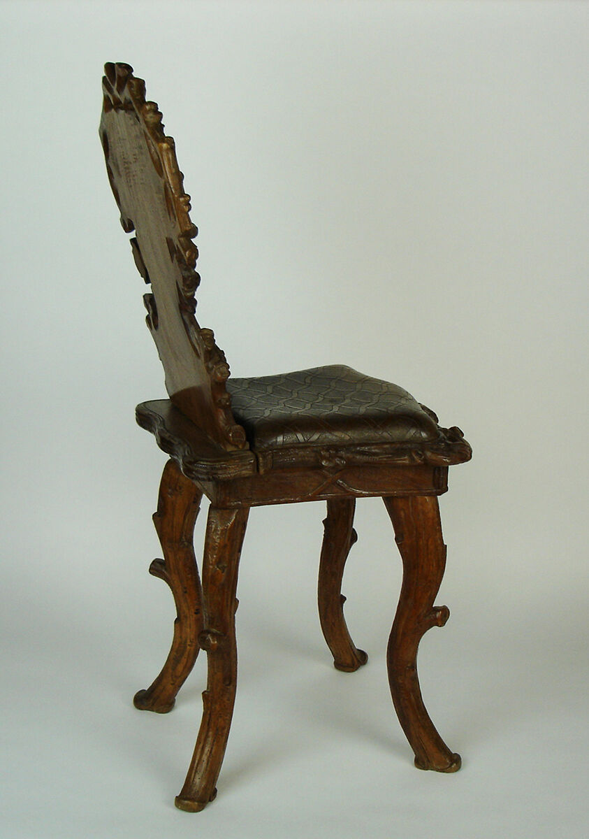 Sculpted chair in "black drill" style