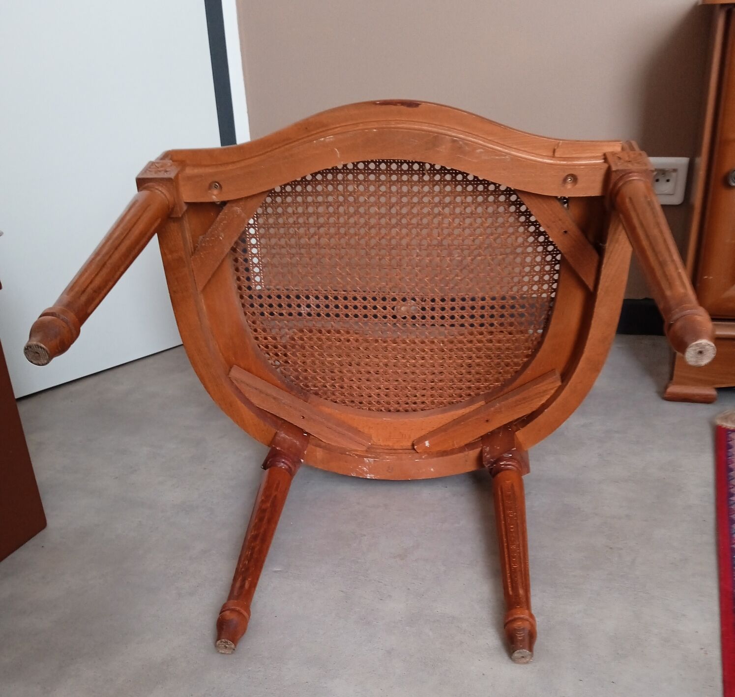 Antique Louis XVI style cane armchair