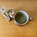 Stoneware pot with glossy glazed brown and vintage speckled gray handle