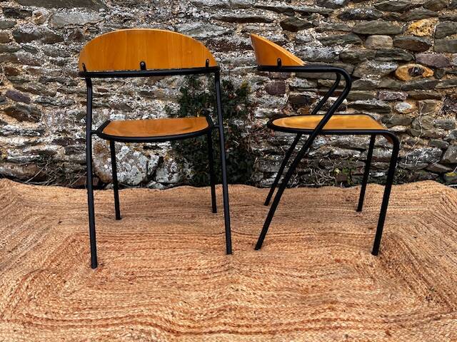 Pair of wooden and black metal chairs