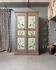 Large antique wardrobe painted with floral decoration.