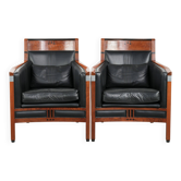 Set of 2 black leather Art Deco design armchairs in good condition