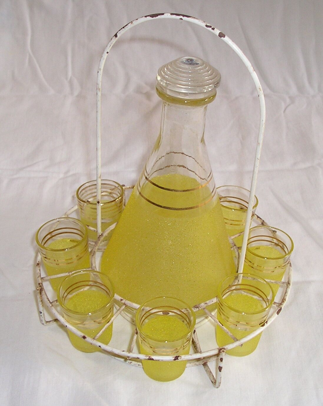 Service liquor Granita yellow glass with metal display stand, 60s/70s