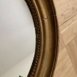 Old oval golden mirror