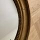 Old oval golden mirror