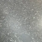 Immense bar counter covered with blue stone.