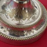 2 candlesticks with a chiseled floral decoration