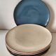 Set of 6 cream and grey-blue glazed earthenware plates.