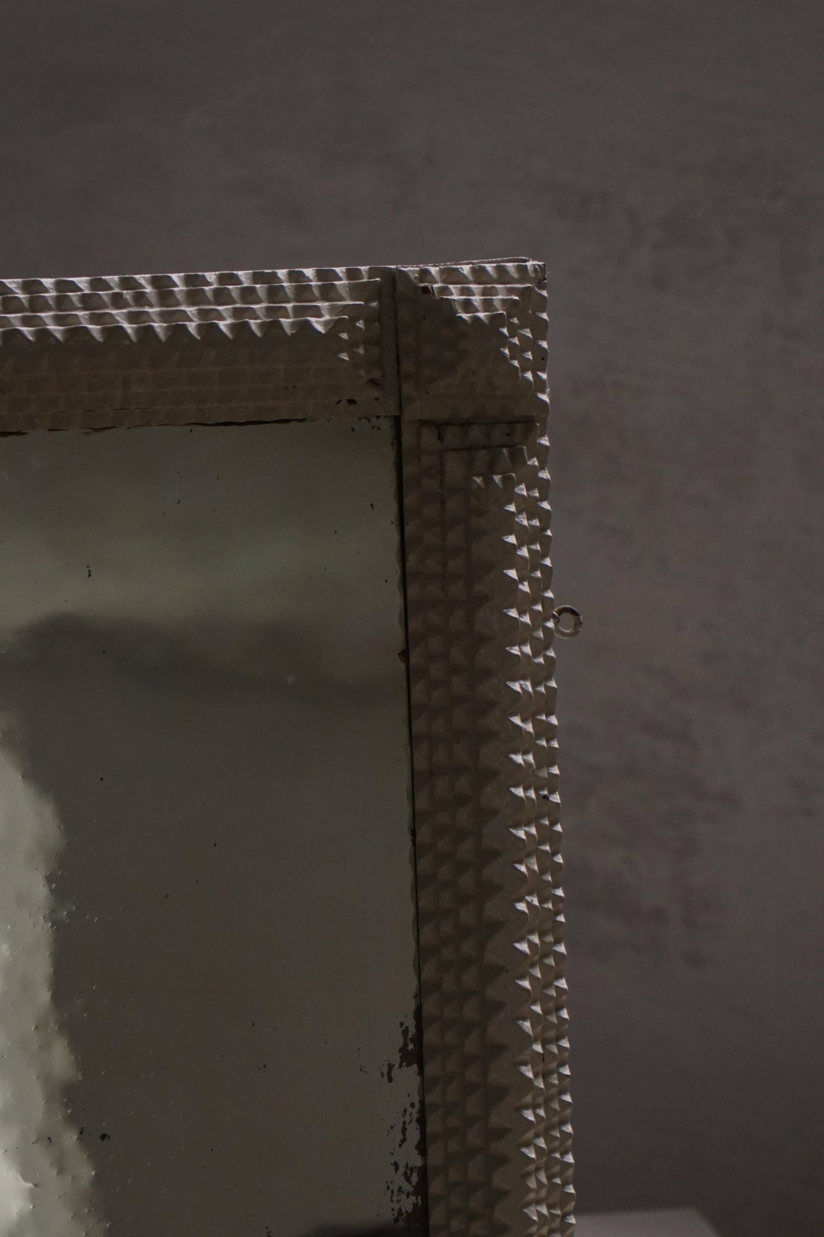 Wall mirror in tramp art style, hand-carved with a painted white frame, early 1900s.