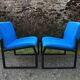 Electric blue fabric designer armchairs with black lacquered metal legs from the 80s.