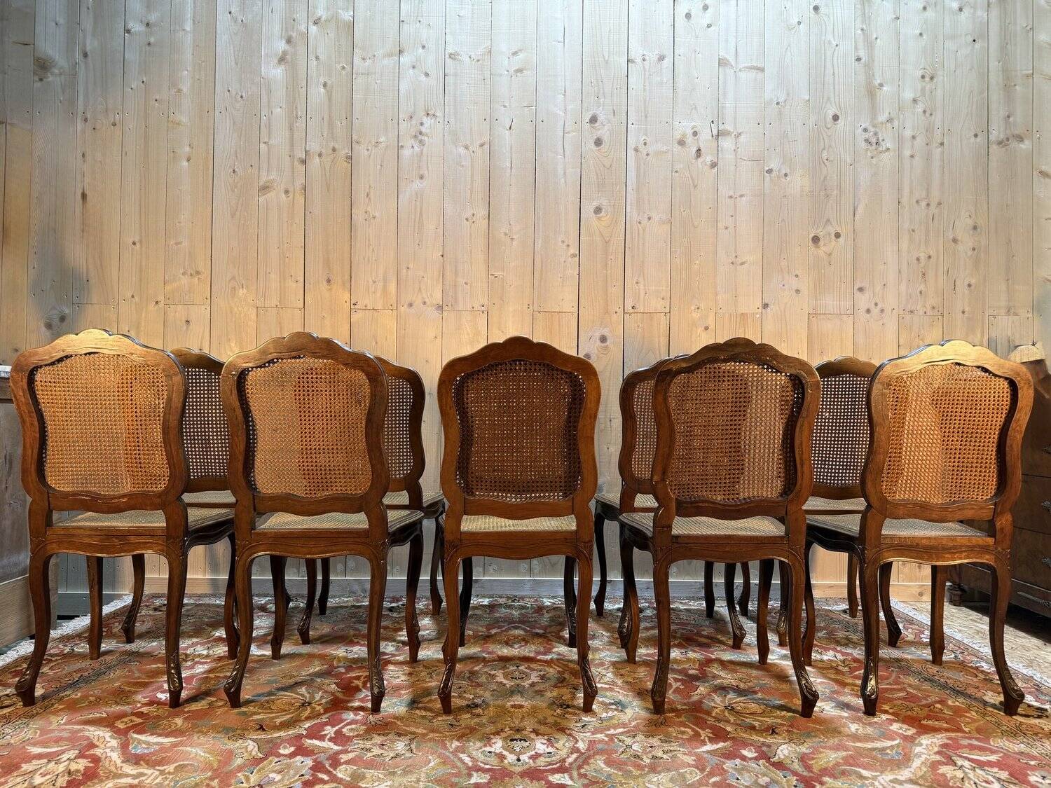 Set of 10 Louis XV style chairs in walnut and cane.