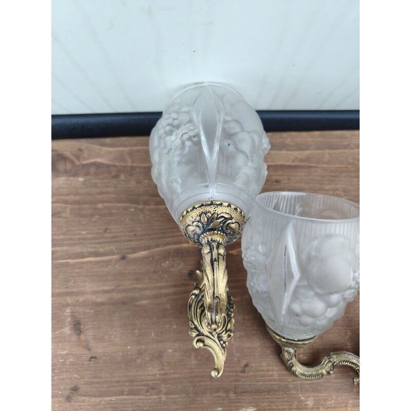 Pair of brass wall lights and glass paste.