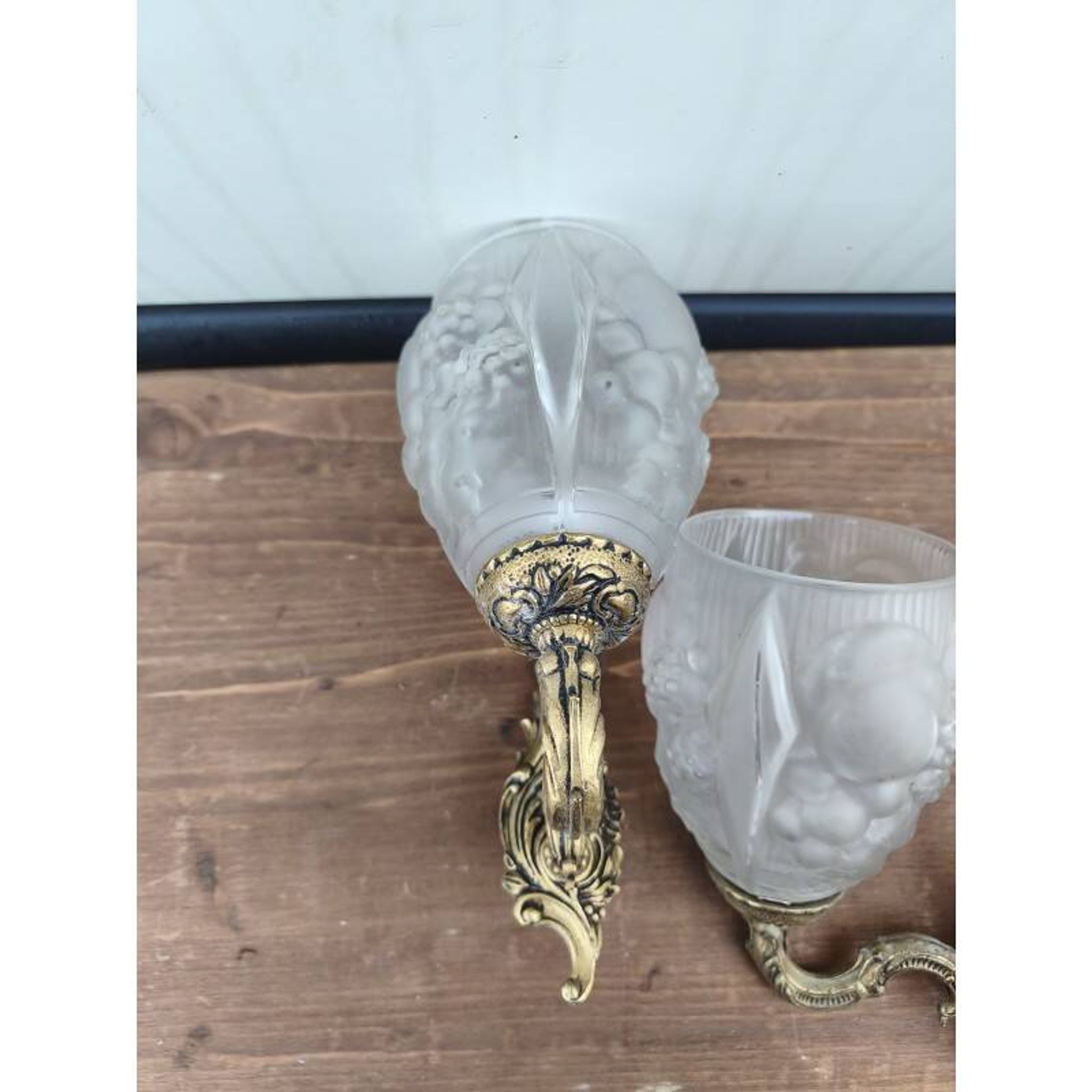 Pair of brass wall lights and glass paste.