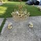 Mid-century chandelier and 2 wall sconces in gilded brass and clear glass, 1960s.