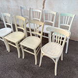 Set of 8 mismatched white bistro chairs