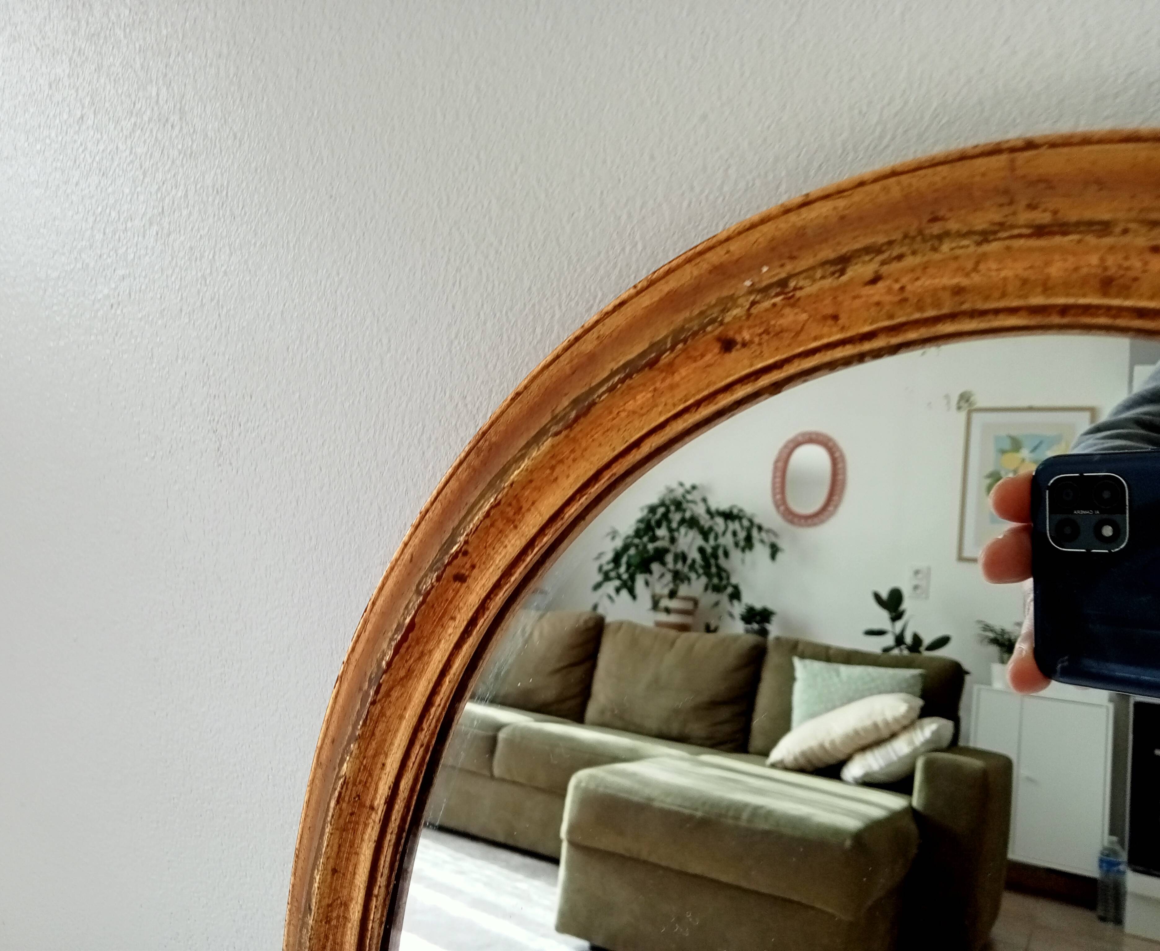 Antique oval mirror in gilded solid wood