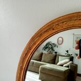 Antique oval mirror in gilded solid wood