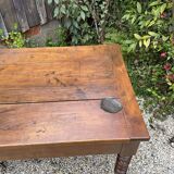 Old kitchen table with chopping board.