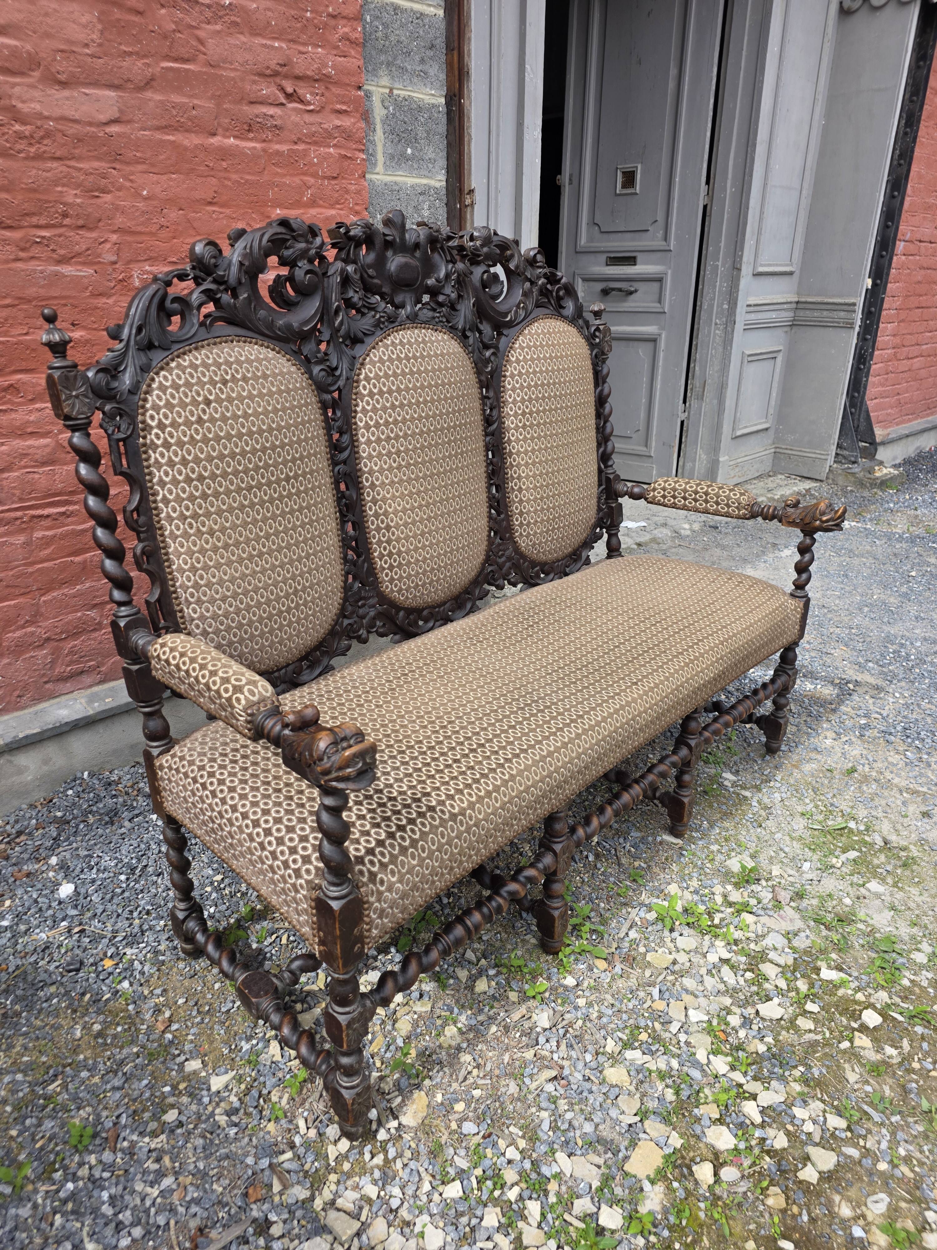 Three-seater armchair in Louis XIII style made of oak from the 19th century.