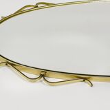 Elegant wall mirror in brass and black from the mid-century, Italy, 1950s.