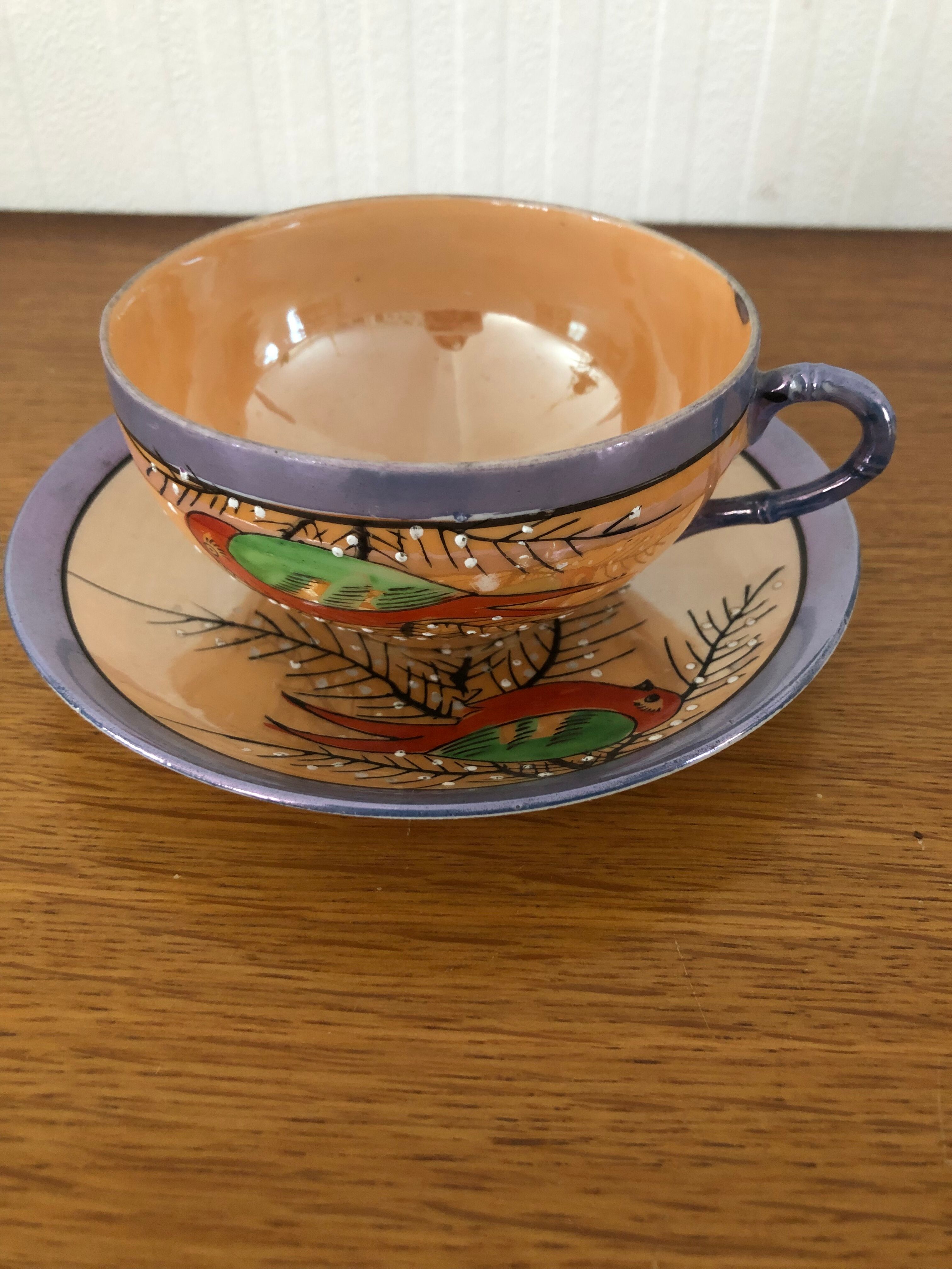 Coffee cup and under cup or tea made of iridescent Japanese porcelain